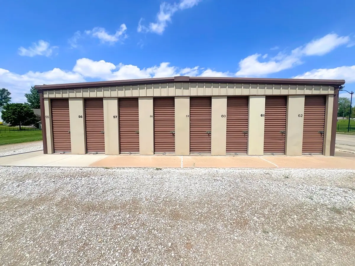 brown storage units with blue sky background